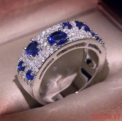 925 zilveren ring met ronde blauwe zirkonen